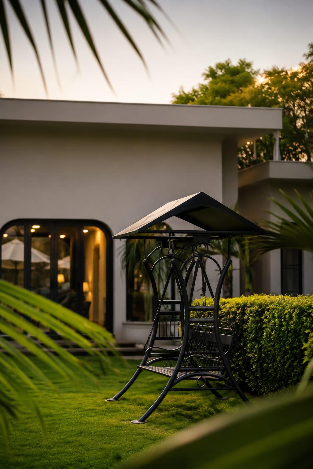 Outdoor seating area with black umbrella shade in backyard